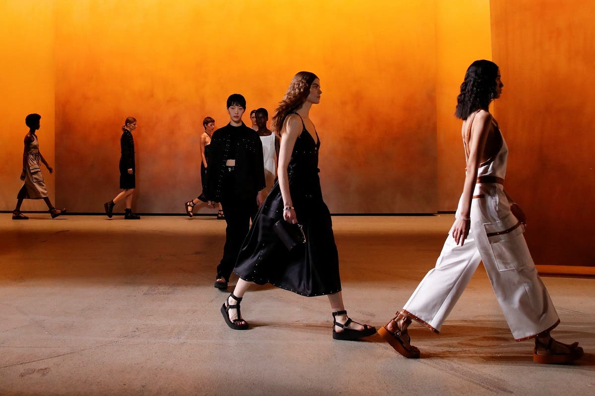 Models present creations by designer Nadege Vanhee-Cybulski as part of a Spring/Summer 2022 women's ready-to-wear collection show for fashion house Hermes during Paris Fashion Week in Paris, France. (Reuters)