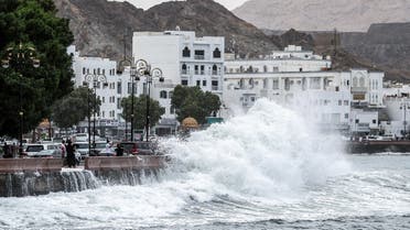 High waves break on the Mutrah sea side promenade in the Omani capital Muscat on October 2, 2021, as the Shaheen tropical storm hits the country. (AFP)
