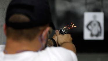 File photo of a man shooting a target in Brasilia, Brazil, Thursday, March 4, 2021. (AP Photo/Eraldo Peres)