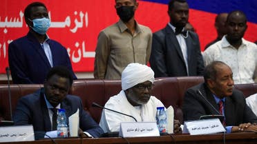 Head of the Sudan Liberation Movement and governor of Darfur Mini Minawi (L) and head of the Justice and Equality Movement and Finance Minister Gibril Ibrahim (C), as well as other political leaders, hold a conference entitled the National Consensus Charter of the Forces of Freedom and Change in Sudan's capital Khartoum, announcing the formation of an alliance separate from the country's main civilian bloc, on October 2, 2021. (AFP)