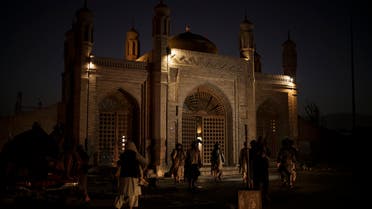 Taliban fighters walk at the entrance of the Eidgah Mosque after an explosion in Kabul, Afghanistan, Sunday, Oct. 3, 2021. (AP)