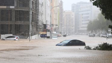 Cars are seen abandoned on a flooded street as Cyclone Shaheen makes landfall in Muscat Oman, October 3, 2021. REUTERS/Sultan Al Hassani NO RESALES. NO ARCHIVES
