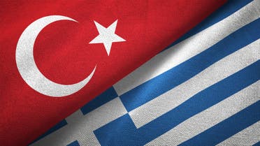 Greece and Turkey two flags together textile cloth fabric texture stock photo