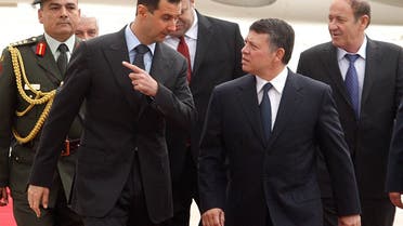 Syria's President Bashar al-Assad speaks to Jordan's King Abdullah (front R) at Amman airport March 20, 2009. (Reuters)