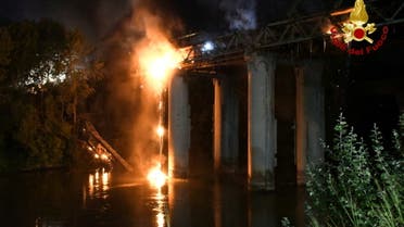 A fire engulfs iconic 'Iron Bridge' in Rome, Italy, October 3, 2021. (Reuters)