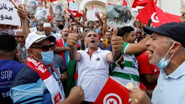 Supporters of Tunisian President Kais Saied rally in support of his seizure of power and suspension of parliament, in Tunis, Tunisia, October 3, 2021. REUTERS/Zoubeir Souissi
