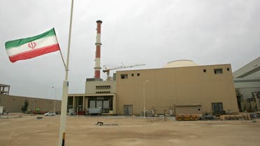 A file photo dated April 3, 2007, shows an Iranian flag outside the building housing the reactor of the Bushehr nuclear power plant in the southern Iranian port town of Bushehr, 1200 Kms south of Tehran. (AFP)