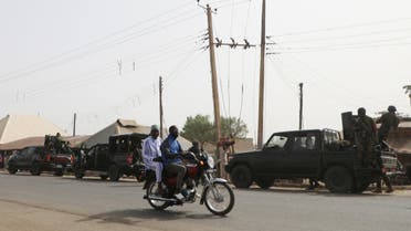 Nigerian military trucks are seen on the road in Kagara where gunmen kidnapped dozens of students and staffs of Government Science College, in Kagara, Rafi Local Government Niger State, Nigeria on February 18, 2021