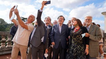 Italian theoretical physicist Giorgio Parisi , center, poses for a selfie photo with his colleagues at the Accademia dei Lincei , on  Oct. 5, 2021, in Rome, after being awarded the 2021 Nobel Prize for Physics, together with Syukuro Manabe and Klaus Hasselmann. (AP)