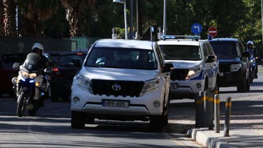 Police vehicles arrive at a court, where a remand order was issued against a man suspected of plotting to murder Israeli businesspeople on the island, in Nicosia, Cyprus October 6, 2021. (Reuters/Yiannis Kourtoglou)