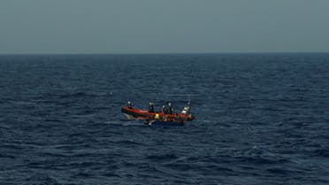 A rigid-hulled inflatable boat (RHIB) from German NGO migrant rescue ship Sea-Watch 3 approaches a wooden boat carrying 12 migrants in international waters, north of Libya, western Mediterranean Sea, August 2, 2021. REUTERS/Darrin Zammit Lupi