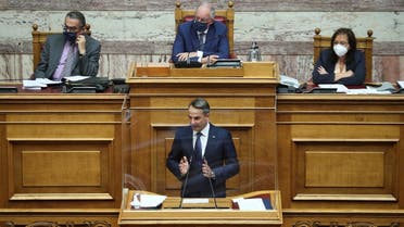 Greek Prime Minister Kyriakos Mitsotakis addresses lawmakers during a parliamentary session before a vote on a defence deal with France, in Athens, Greece, October 7, 2021. (Reuters/Costas Baltas)