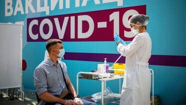 A healthcare worker prepares a dose of Russia's Sputnik V Covid-19 vaccine at a vaccination centre at Gostiny Dvor in Moscow, on July 7, 2021. (AFP)
