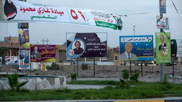 A picture shows electoral campaign posters on October 6, 2021 in the southern city of Basra. War-scarred Iraq will hold parliamentary elections on October 10, a year ahead of schedule to appease an anti-government protest movement, and amid a painful economic crisis.