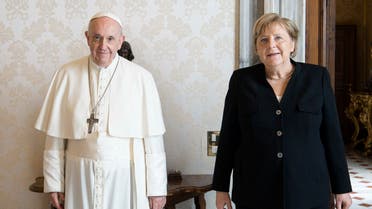 This photo taken and handout on October 7, 2021 by the Vatican media shows Pope Francis and German chancellor Angela Merkel during a private audience at the Vatican. (AFP/Vatican media)