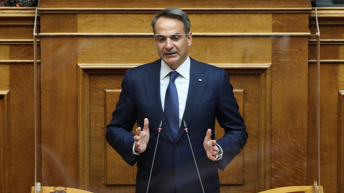 Greek Prime Minister Kyriakos Mitsotakis addresses lawmakers during a parliamentary session before a vote on a defence deal with France, in Athens, Greece, October 7, 2021. REUTERS/Costas Baltas