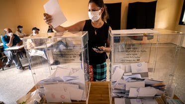 A woman prepares to cast her ballot during Morocco's parliamentary and local elections in the capital Rabat on September 8, 2021. (AFP)