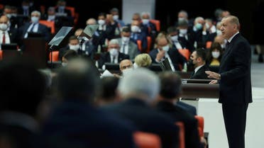 Turkey’s President Tayyip Erdogan addresses members of parliament as he attends the reopening of the Turkish parliament after the summer recess in Ankara, Turkey, October 1, 2021. Murat (Cetinmuhurdar/PPO/Handout via Reuters)