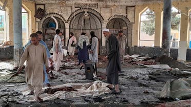 People view the damage inside of a mosque following a bombing in Kunduz, province northern Afghanistan, Friday, Oct. 8, 2021. (AP/Abdullah Sahil)