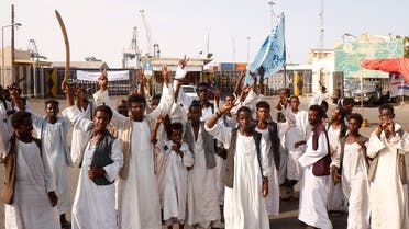 Sudanese protesters gather outside the main entrance to the southern port in Port Sudan on September 20, 2021. (Ibrahim Ishaq/AFP)