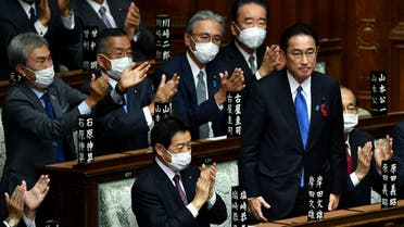 Leader of Japan's ruling Liberal Democratic Party (LDP) Fumio Kishida (2nd R) is applauded after being elected as new prime minister at the lower house of parliament in Tokyo on October 4, 2021. (AFP)