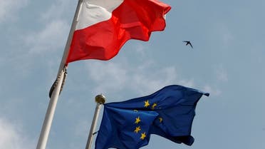 The flags of Poland and European Union flutter in front of the Polish parliament in Warsaw. (Reuters)