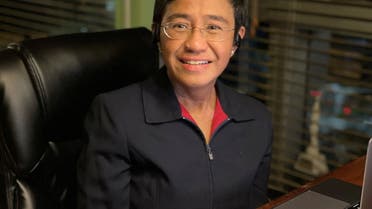 Filipino journalist and 2021 Nobel Peace Prize winner Maria Ressa sits by the desk at her home in Manila, Philippines, October 8, 2021. (Reuters)