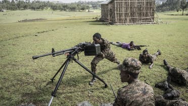 Ethiopian National Defence Forces (ENDF) soldiers train with a DShK 1938, a Soviet heavy machine gun, in the field of Dabat, 70 kilometers Northeast of the city of Gondar, Ethiopia, on September 15, 2021. (AFP)