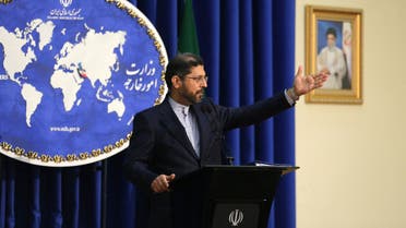 Iranian foreign ministry spokesman Saied Khatibzadeh speaks during a press conference in Tehran on February 22, 2021. Iran hailed as a significant achievement a temporary agreement Tehran reached with the head of the UN nuclear watchdog on site inspections. That deal effectively bought time as the United States, European powers and Tehran try to salvage the 2015 nuclear agreement that has been on the brink of collapse since Donald Trump withdrew from it.