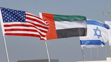 The national flags of (L-R) US, United Arab Emirates, and Israel are flown along a road, in the resort city of Netanya in central Israel, on September 13, 2020. (AFP)