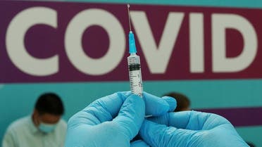 A healthcare worker prepares a dose of Sputnik V (Gam-COVID-Vac) vaccine against the coronavirus at a vaccination centre in Gostiny Dvor in Moscow, Russia. (Reuters)