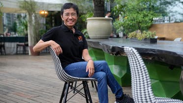 Rappler CEO and Executive Editor Maria Ressa smiles at a restaurant in Taguig city, Philippines on Saturday, Oct. 9, 2021. The Nobel Peace Prize was awarded to journalists Maria Ressa of the Philippines and Dmitry Muratov of Russia for their fight for freedom of expression. (AP)