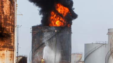 Firefighters attempt to put out a fire at the Zahrani oil facility in southern Lebanon, October 11, 2021 (File photo: Reuters)