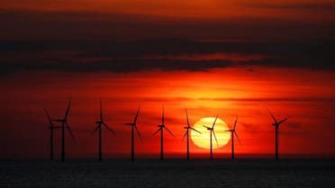 The sun sets behind the Burbo Bank wind farm near New Brighton, Britain. (Reuters)