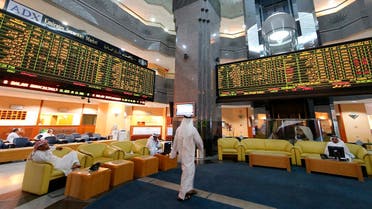 Screens displaying stock information are seen at the Abu Dhabi Securities Exchange. (File photo: Reuters)