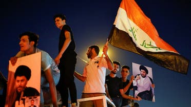 Iraqi supporters of Sadr's movement celebrate after preliminary results of Iraq's parliamentary election were announced in Baghdad, Iraq October 11, 2021. (Reuters)