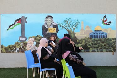 Palestinian women participate in a breast cancer awareness campaign aimed to raise public awareness in Gaza over the need for early tests to discover breast cancer, in Khan Yunis, in the southern Gaza Strip, October 7, 2021. Picture taken October 7, 2021. REUTERS/Ibraheem Abu Mustafa