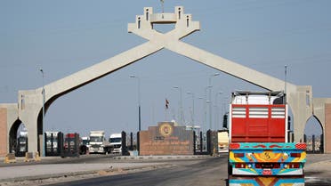 Trucks drive through the main gate of the El Ain El Sokhna port near the desert road of Suez city north of Cairo, Egypt August 14, 2016. Picture taken August 14, 2016. REUTERS/Amr Abdallah Dalsh
