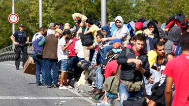 Migrants line up as they wait to cross the border from Austria to Germany near Freilassing, Germany September 17, 2015. (File photo: Reuters)