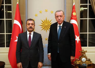 Turkey Central Bank governor Sahap Kavcioglu (left) with President Recep Erdogan (right) at the presidential mansion in Ankara. (Turkish presidency via Twitter)