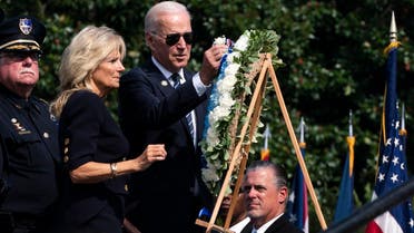 President Joe Biden with first lady Jill Biden place flowers on a wreath during a ceremony honoring fallen law enforcement officers at the 40th annual National Peace Officers' Memorial Service at the US Capitol in Washington, Saturday, Oct. 16, 2021. (AP)