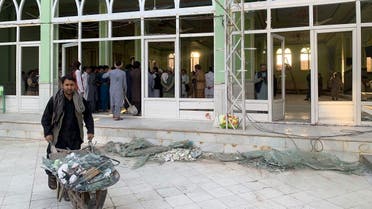 People view the damage inside of a mosque following a suicide bombers attack in the city of Kandahar, southwest Afghanistan, on Oct. 15, 2021. (AP)
