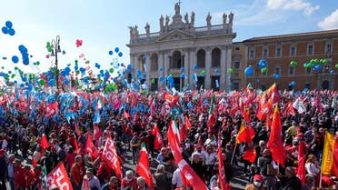 Demonstrators take part in a march organized by Italy's main labor unions, in Rome's St. John Lateran square, on Oct. 16, 2021. (AP