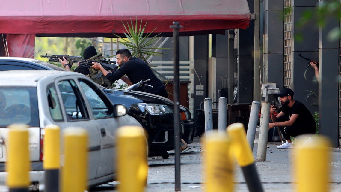 Gunmen take position after gunfire erupted in Beirut, Lebanon October 14, 2021. REUTERS/Aziz Taher