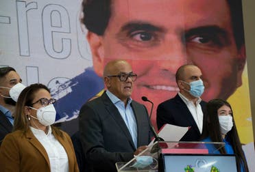 Venezuelan President of the National Assembly Jorge Rodriguez, center, speaks to the press as an image of Colombian businessman and Venezuelan special envoy Alex Saab is in the back in Caracas, Venezuela, Saturday, Oct 16, 2021. (AP)