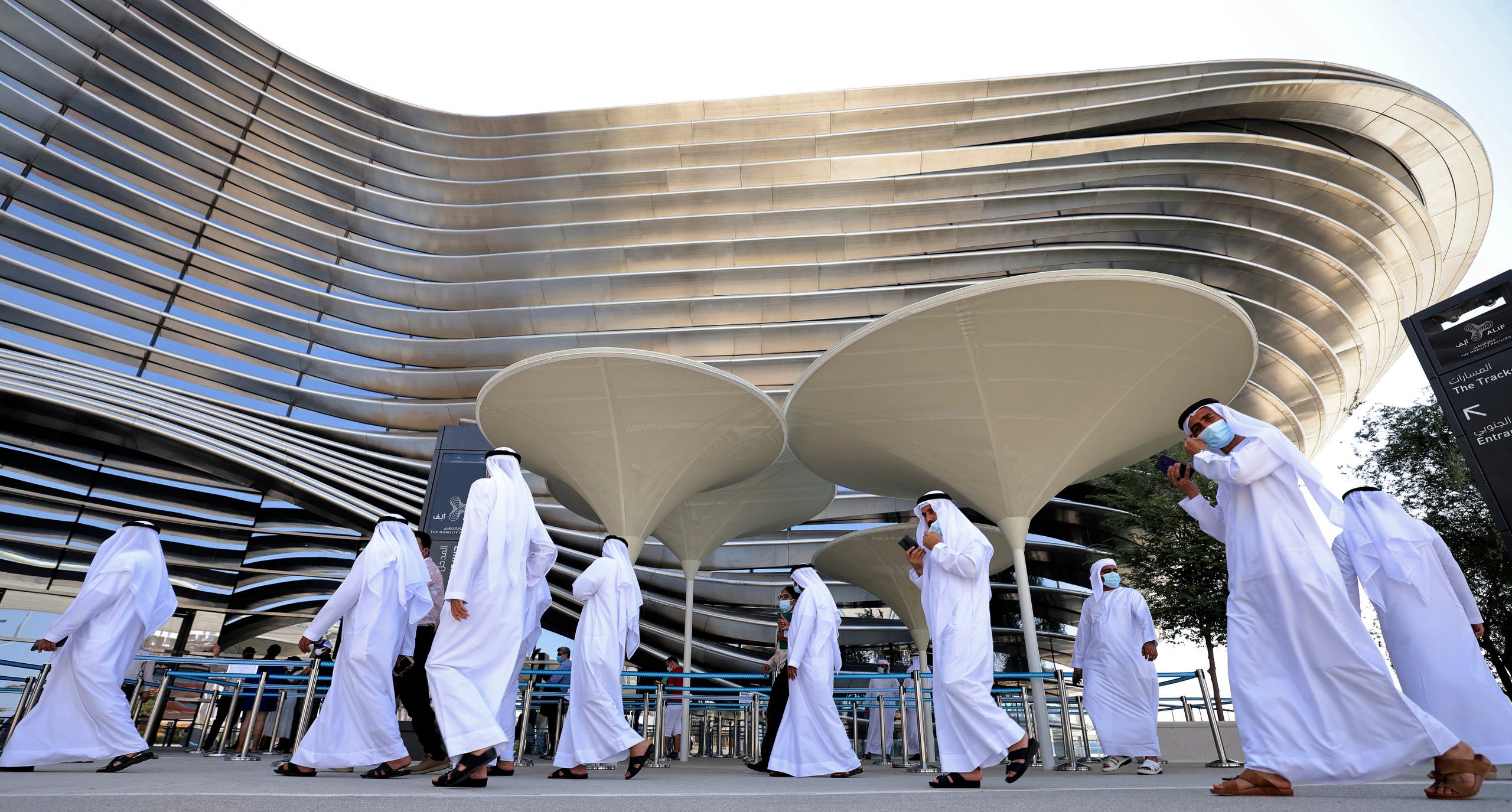 isitors walk outside the Sustainability pavilion at the Expo 2020 in the Gulf Emirate of Dubai on October 6, 2021. (AFP)
