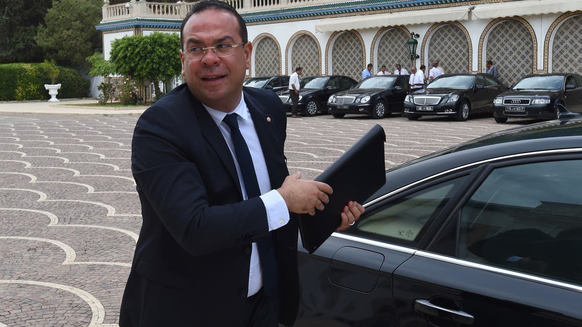 Tunisian Minister of Civil Society and Human Rights Mehdi Ben Gharbia arrives for the first cabinet meeting on August 31, 2016 at the Carthage Palace near Tunis. (Photo by FETHI BELAID / AFP)
