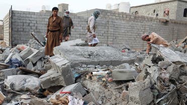 People browse through the rubble of a house destroyed by Houthi missile attack in Marib, Yemen, October 3, 2021. Picture taken October 3, 2021. REUTERS/Ali Owidha