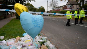 Floral tributes lie near to where British lawmaker David Amess was killed Friday during a meeting with constituents at the Belfairs Methodist Church, in Leigh-on-Sea, Essex, England, Sunday, Oct. 17, 2021. (AP)