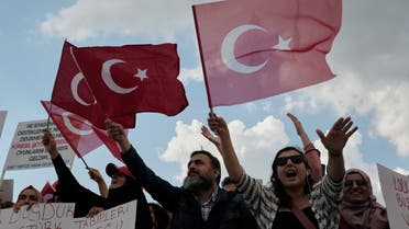 Demonstrators wave Turkish flags as they shout slogans during a protest against official coronavirus disease (COVID-19)-related mandates including vaccinations, tests and masks, in Istanbul, Turkey September 11, 2021. REUTERS/Murad Sezer